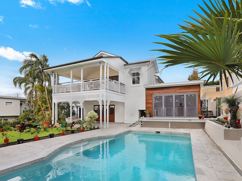 Single-story stucco home with tidy front yard
